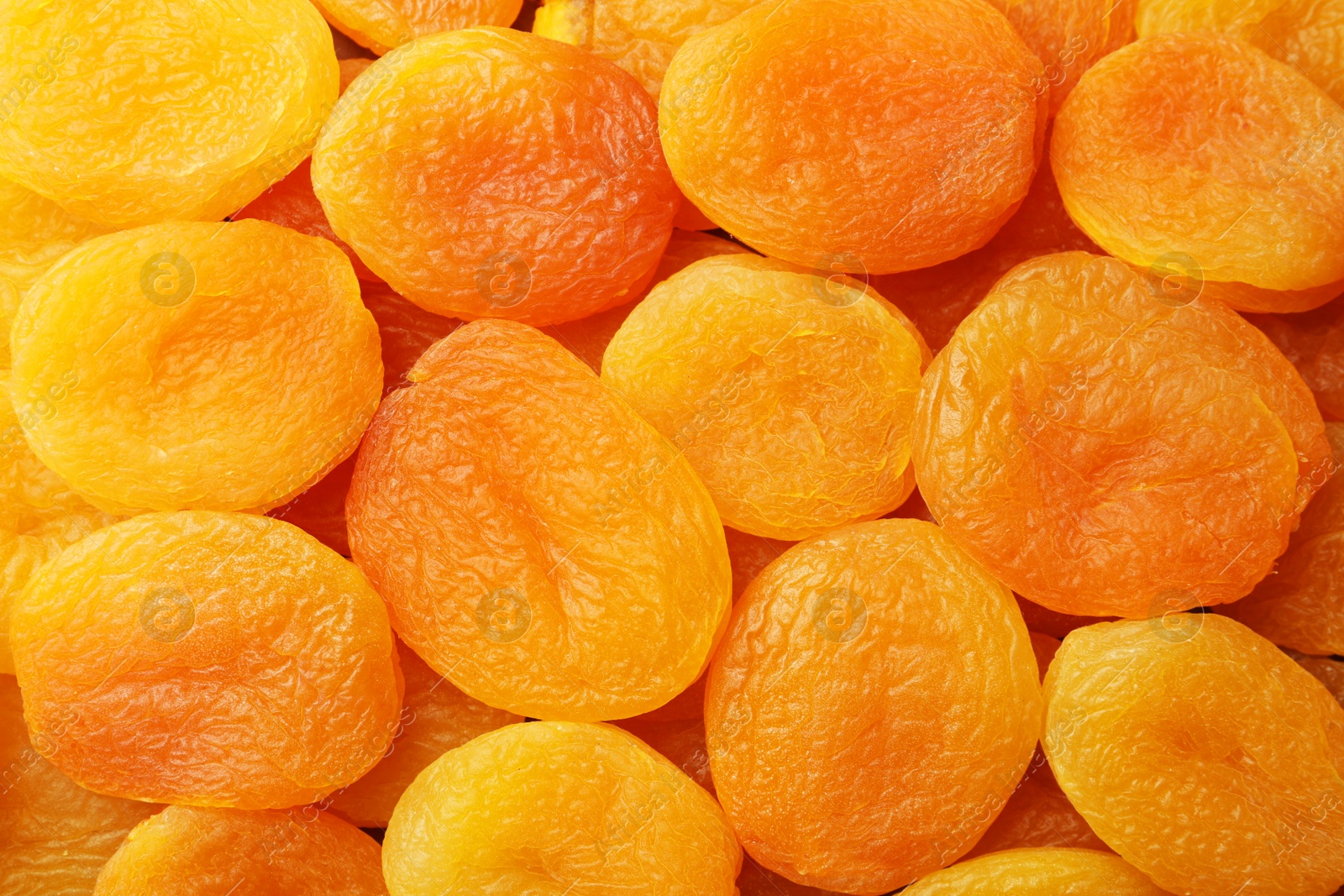 Photo of Tasty dried apricots as background, top view. Healthy snack