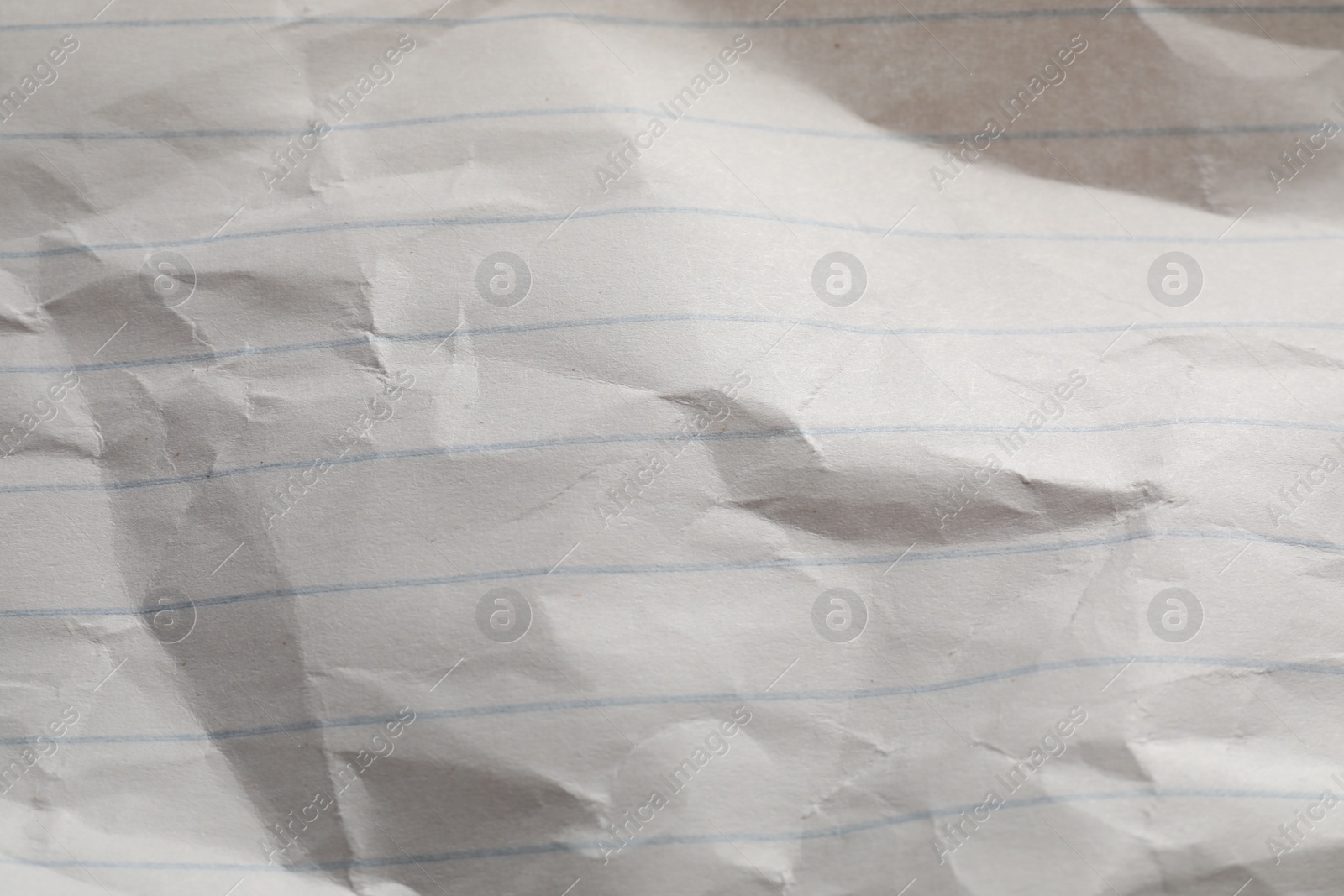 Photo of Crumpled sheet of paper as background, top view