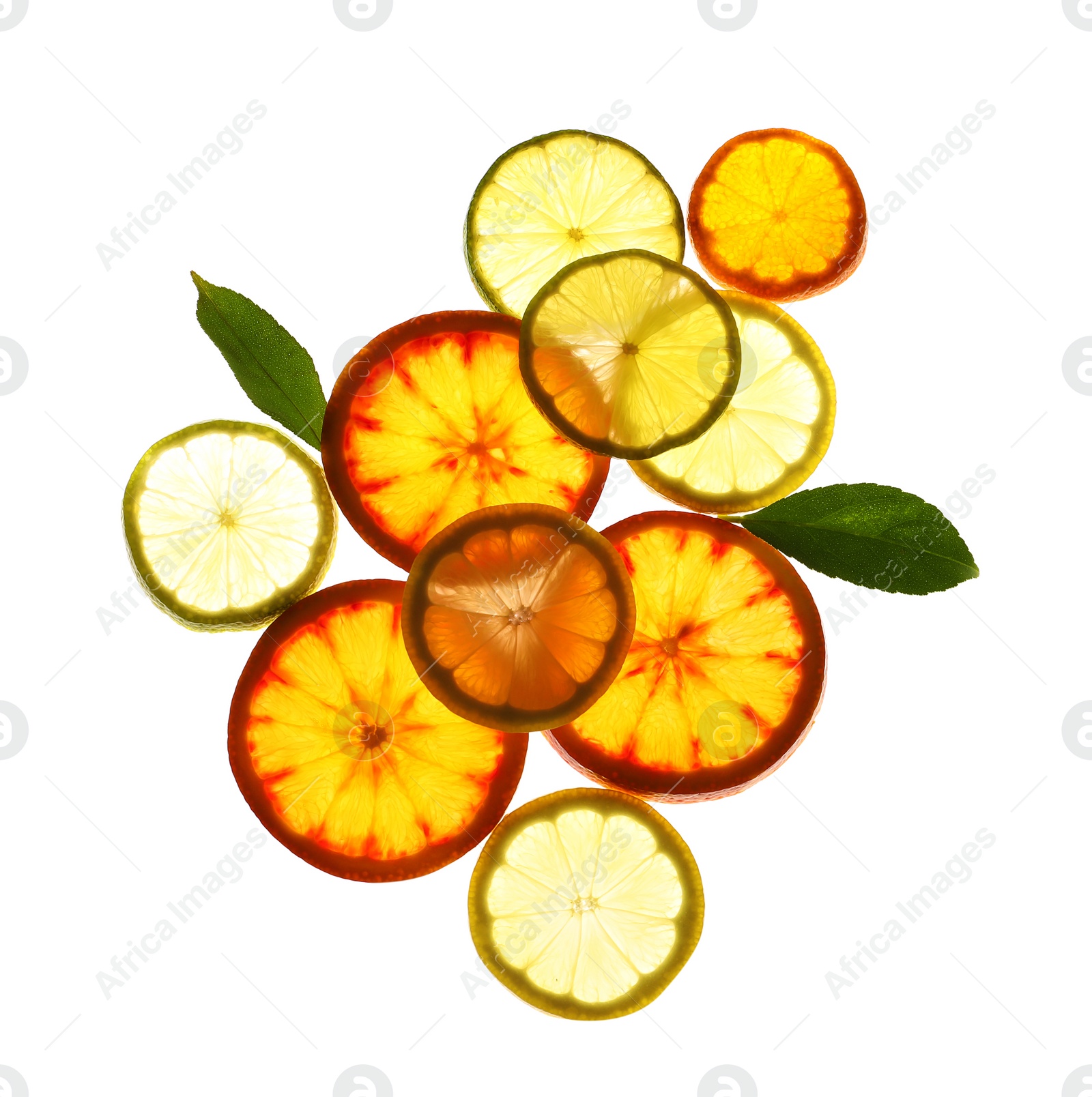 Photo of Illuminated slices of citrus fruits and leaves on white background, top view