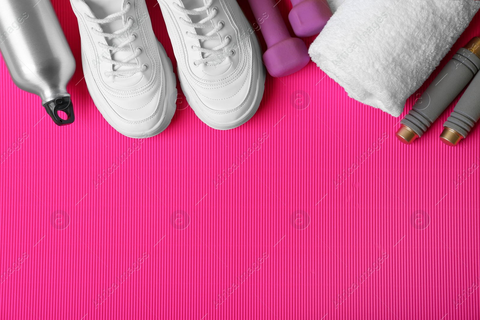 Photo of Flat lay composition with fitness equipment and space for text on color background