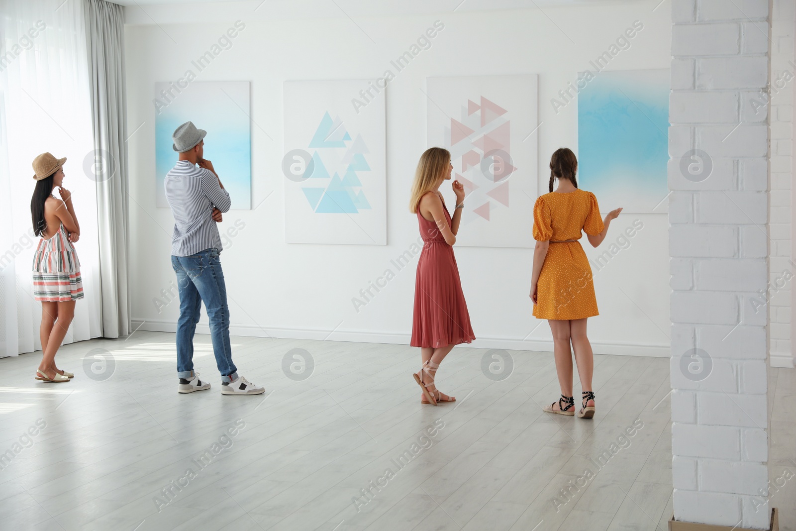 Photo of Group of people at exhibition in art gallery