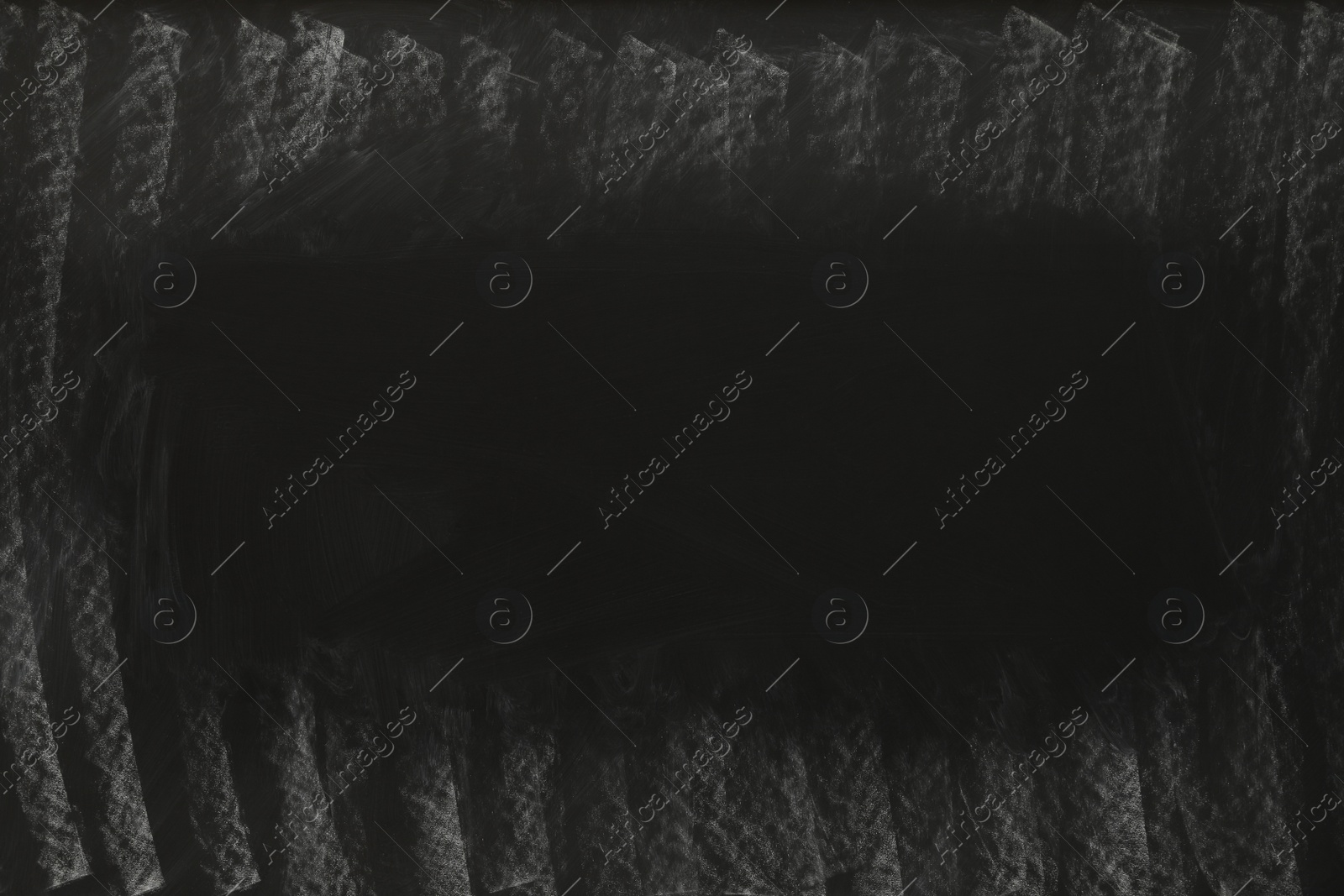 Photo of Dirty black chalkboard as background. School equipment