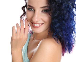Photo of Young woman with bright dyed hair on white background, closeup