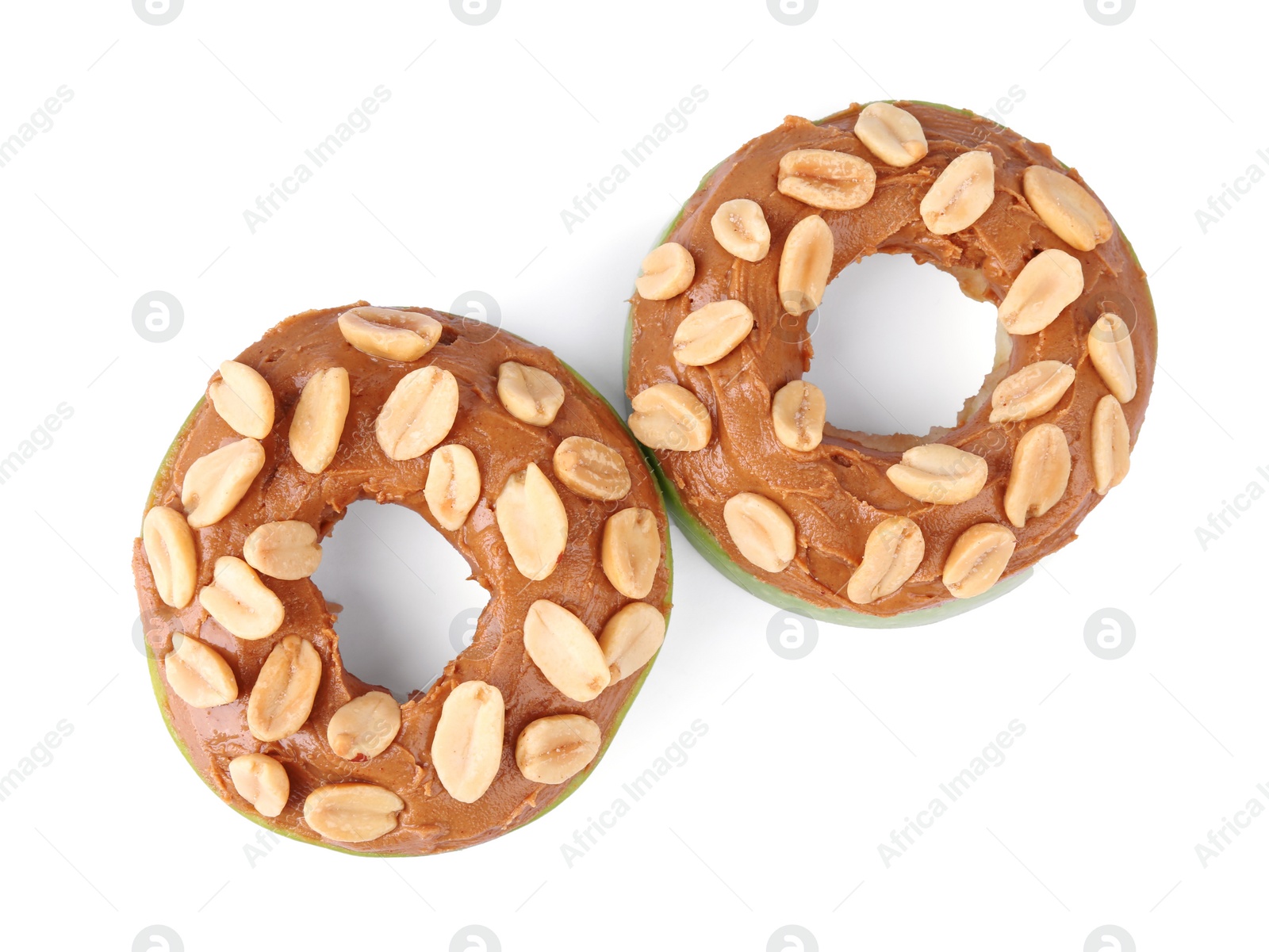 Photo of Slices of fresh apple with peanut butter and nuts isolated on white, top view