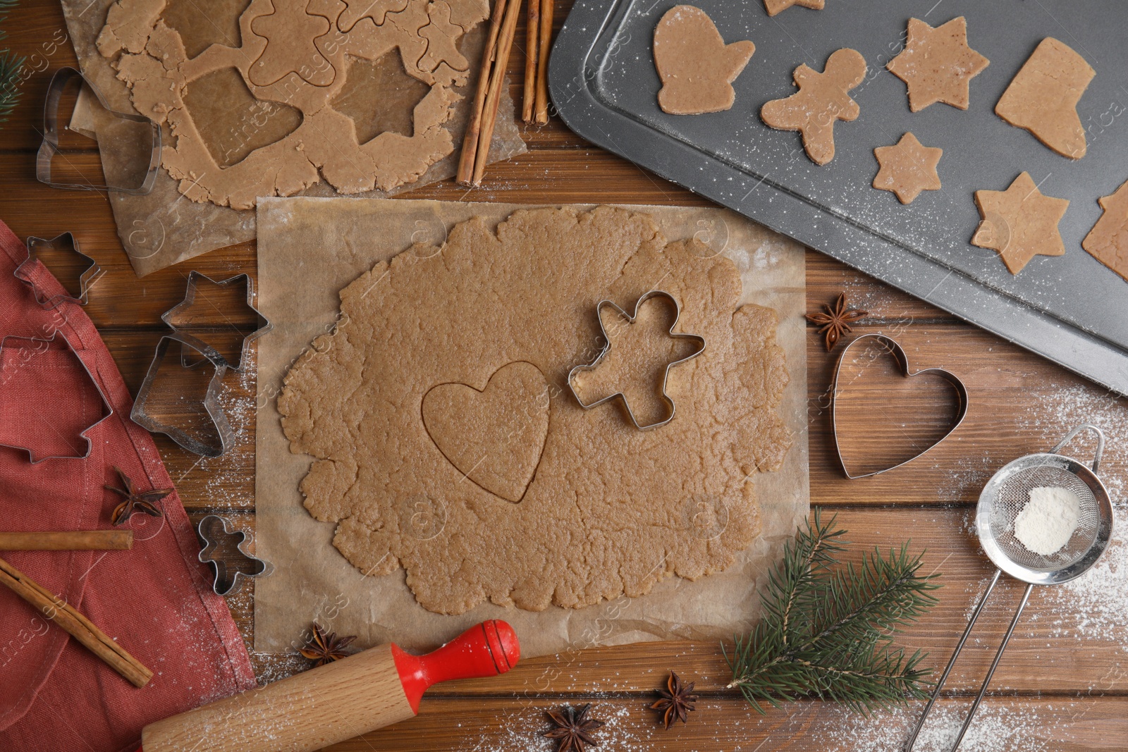 Photo of Homemade Christmas cookies. Flat lay composition with dough on wooden table