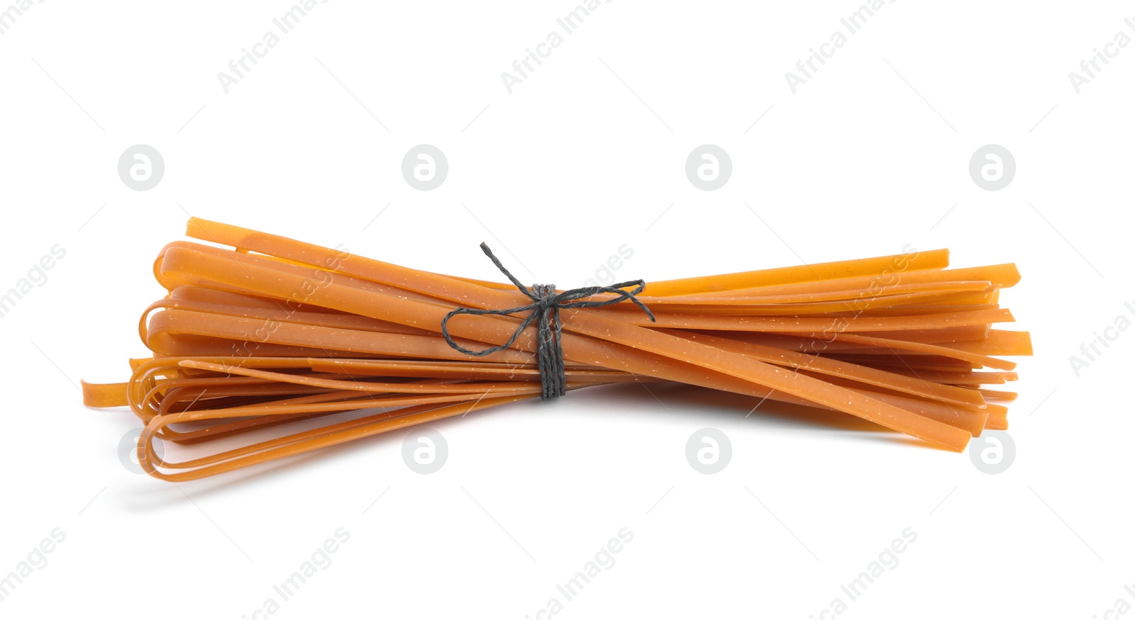 Photo of Tied uncooked buckwheat noodles isolated on white