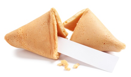 Photo of Cracked traditional fortune cookie with prediction on white background