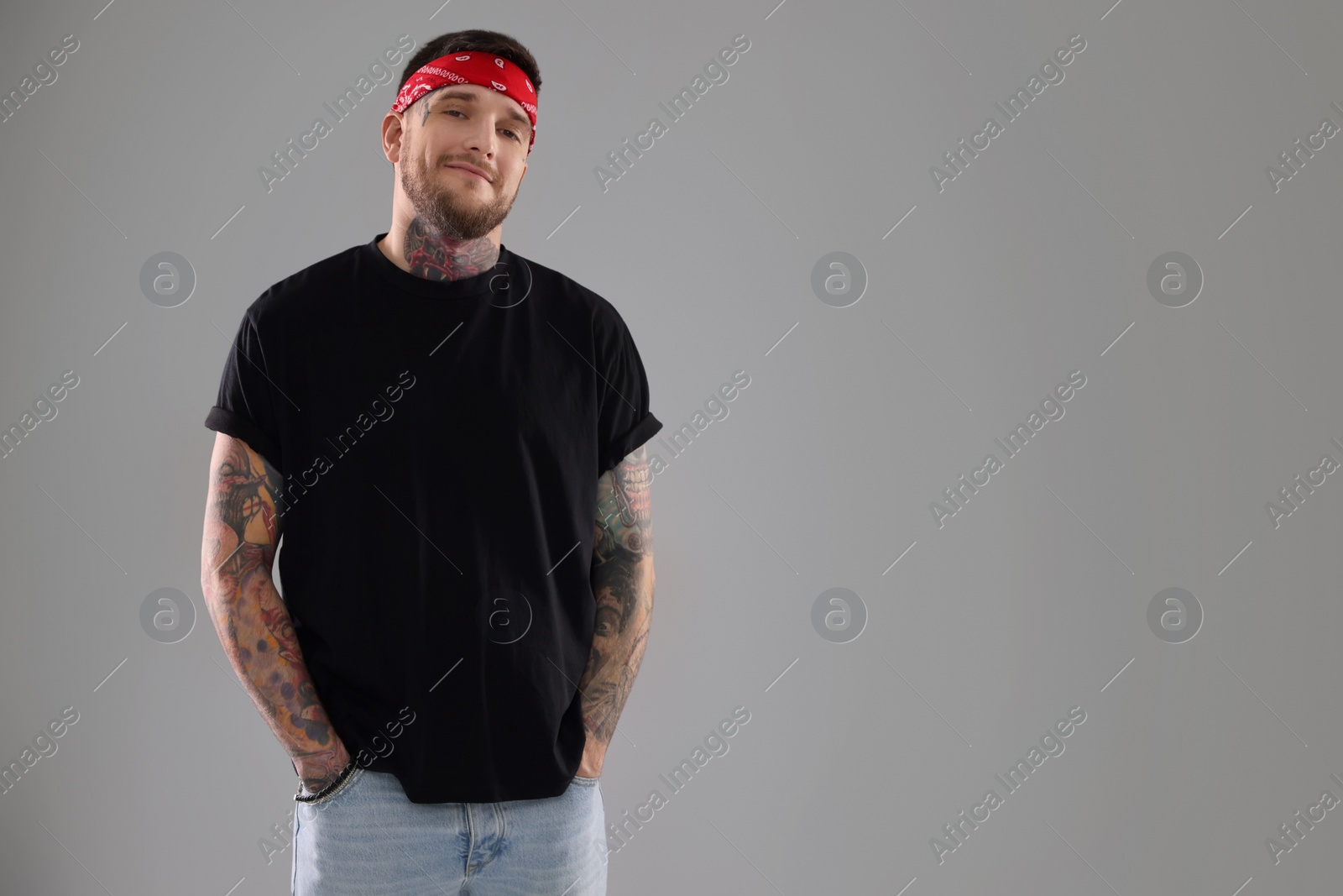 Photo of Portrait of handsome hipster man on light grey background. Space for text
