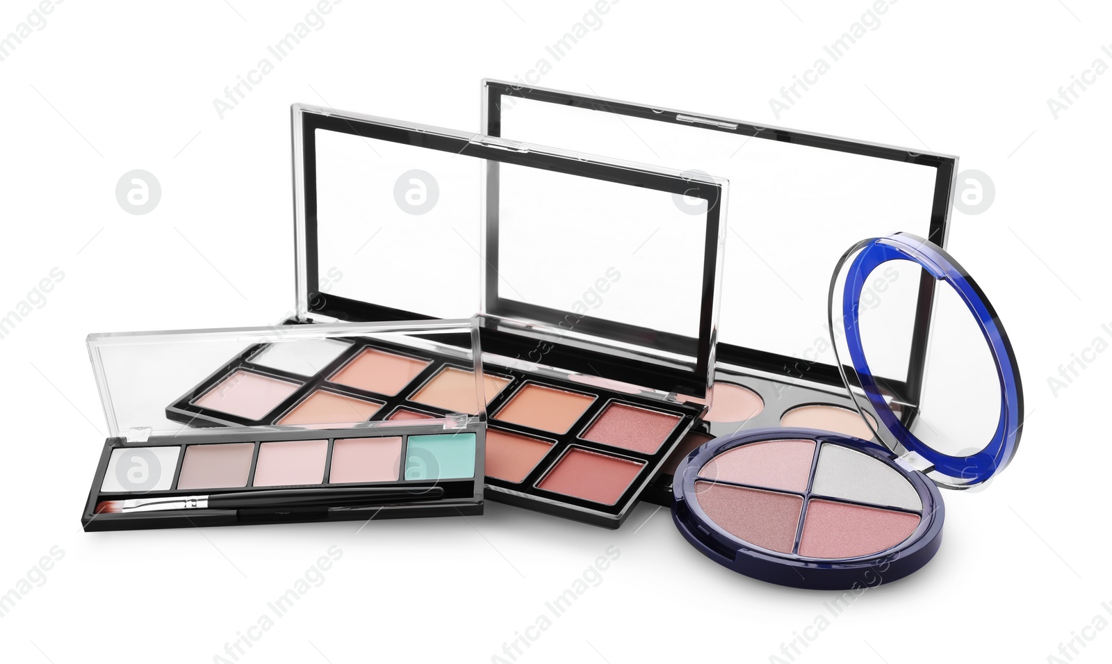 Photo of Colorful contouring palettes on white background. Professional cosmetic products