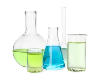 Photo of Glassware with color liquids for laboratory analysis isolated on white