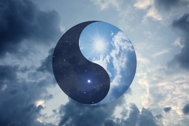 Image of Ying Yang symbol against cloudy sky. Feng Shui philosophy