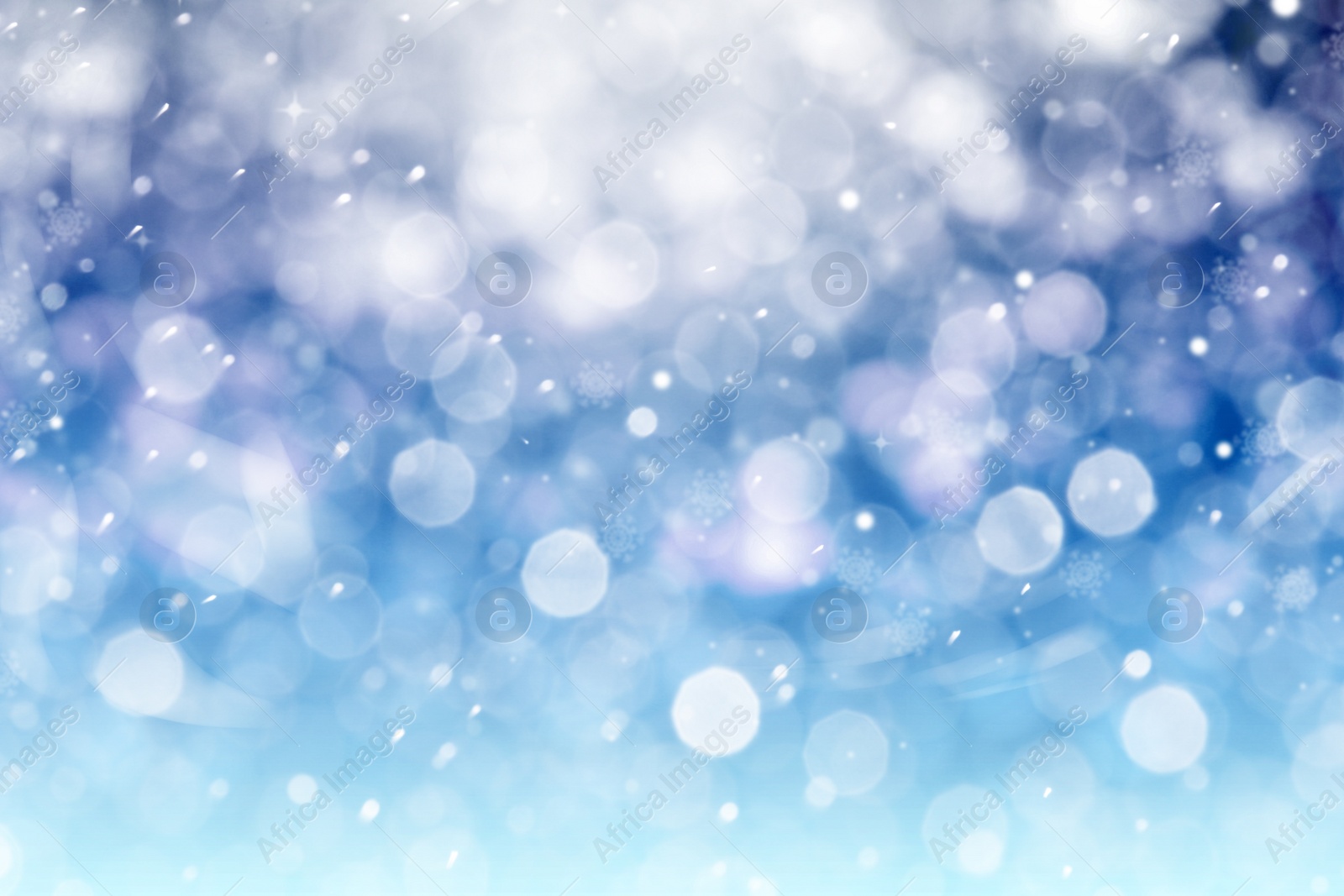 Image of Abstract snowfall on blue background, bokeh effect