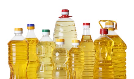 Bottles of cooking oil on white background
