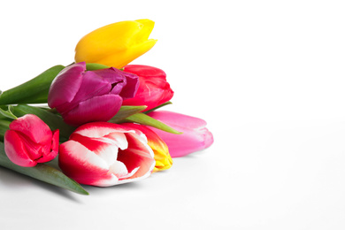 Photo of Beautiful bright spring tulips on white background, closeup