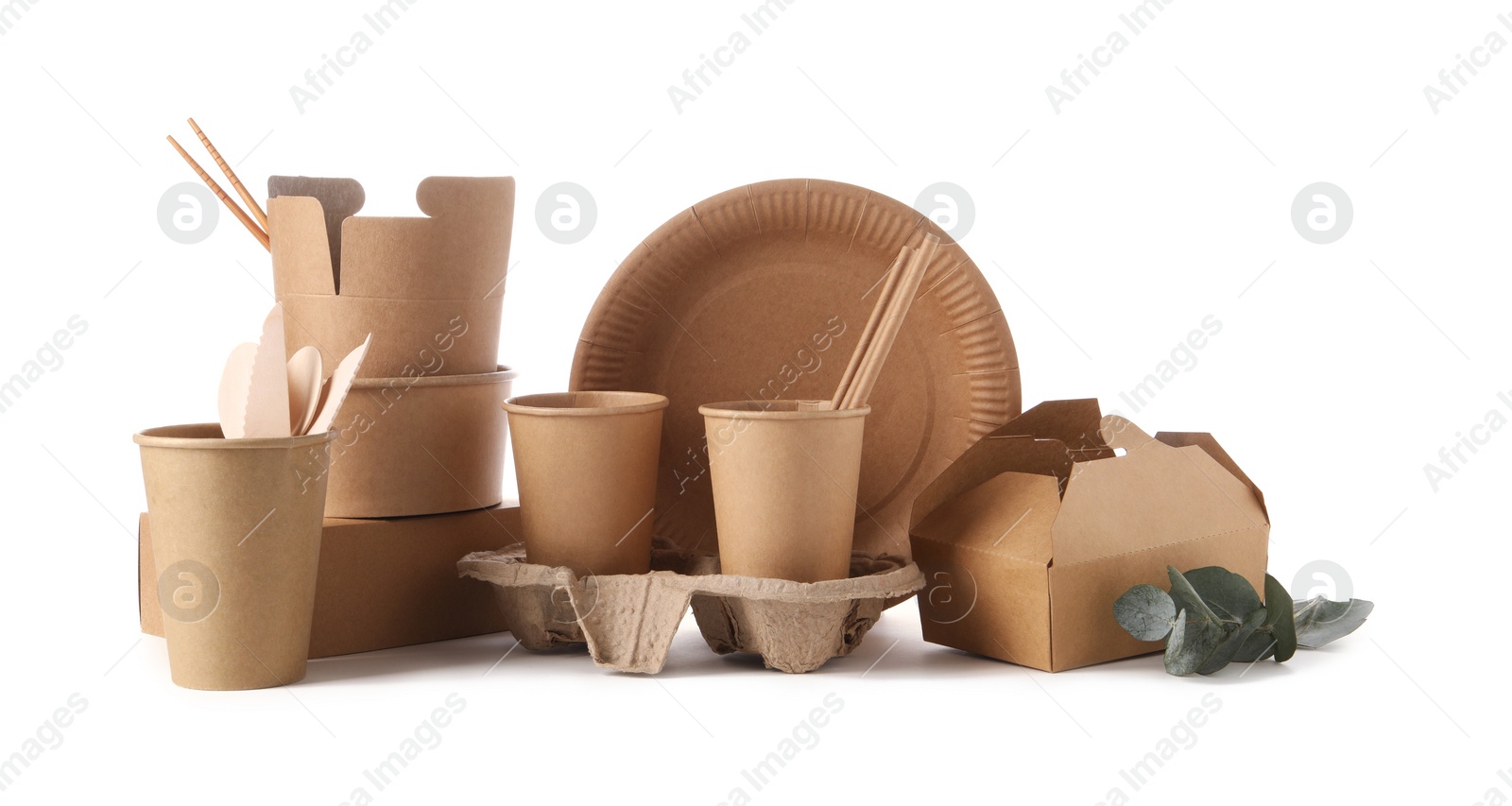 Photo of Eco friendly food packagings, tableware and eucalyptus leaves isolated on white