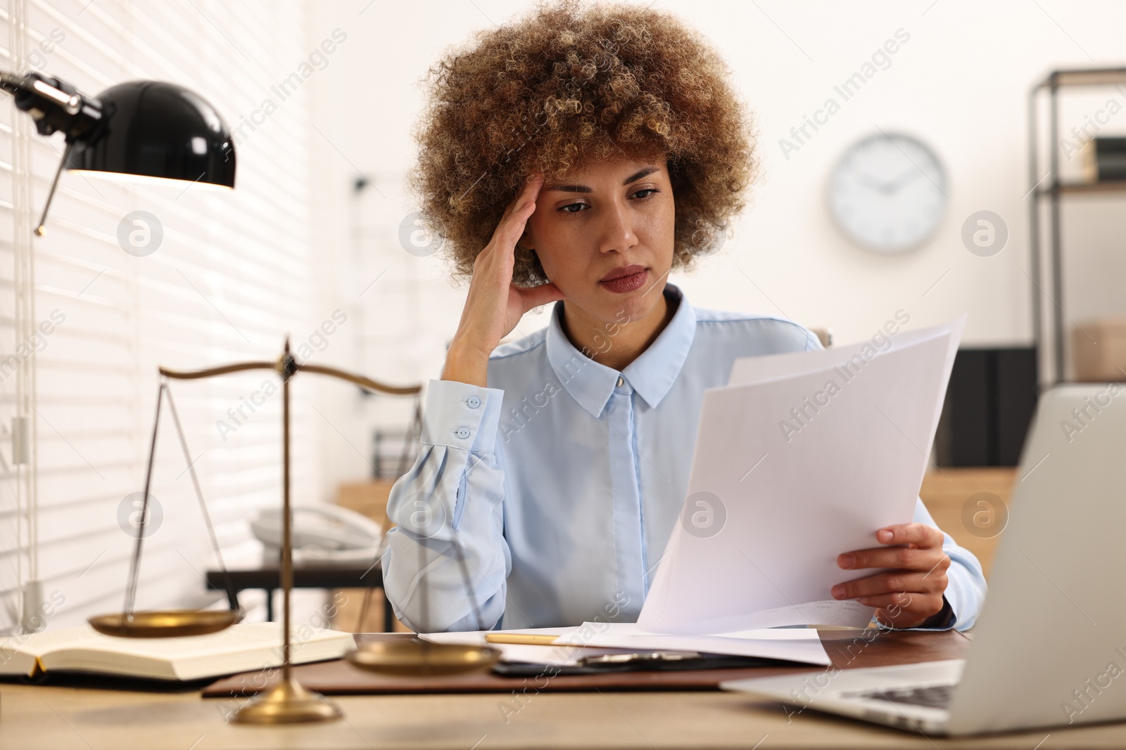 Photo of Notary working with documents at workplace in office