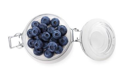 Photo of Jar of tasty yogurt with blueberries isolated on white, top view
