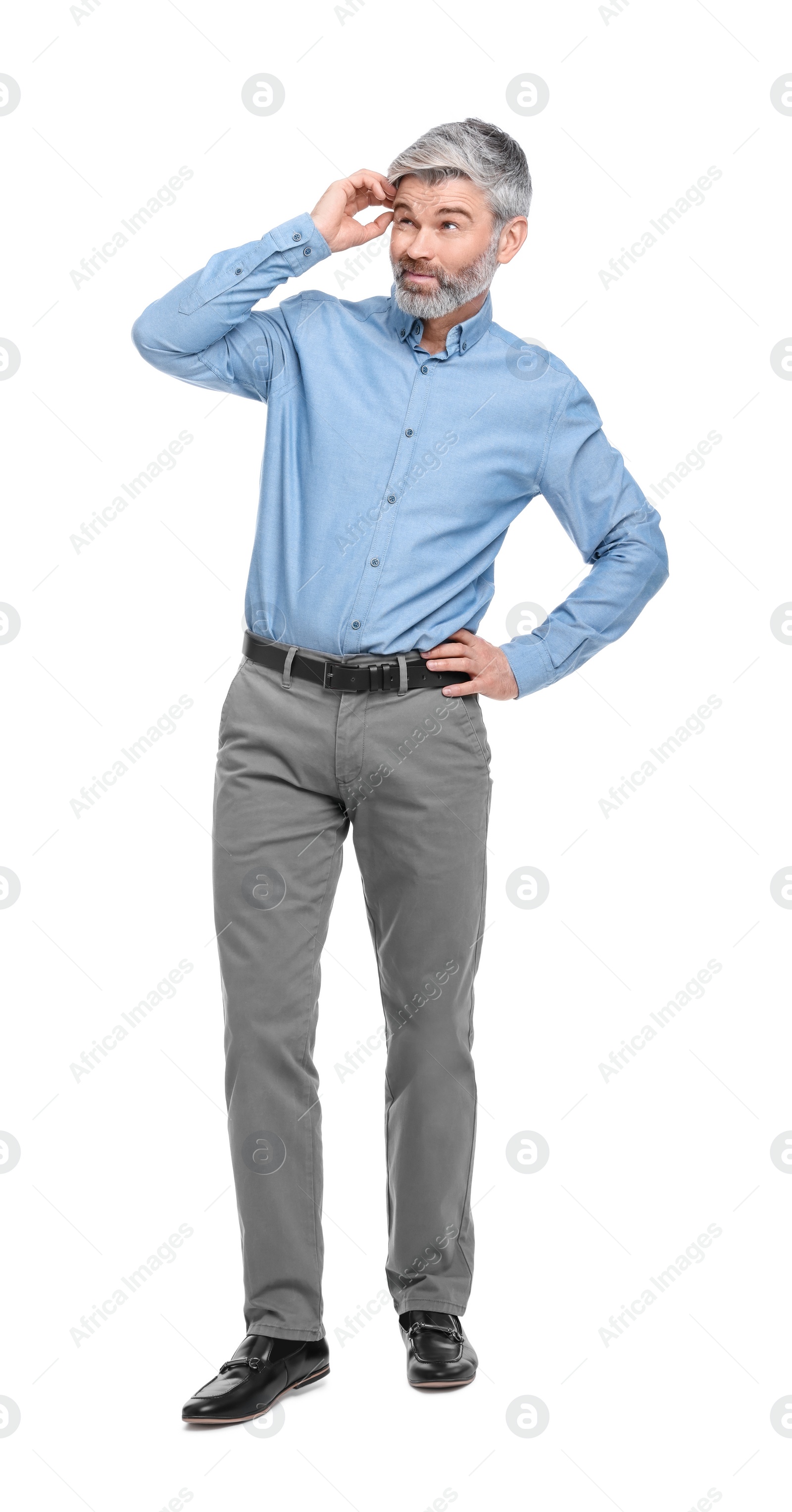 Photo of Mature businessman in stylish clothes posing on white background