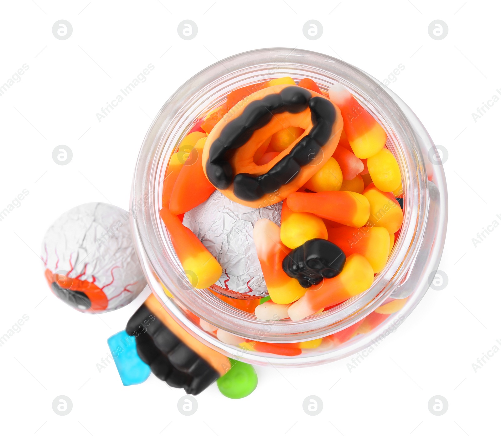 Photo of Jar of delicious colorful candies isolated on white, top view. Halloween sweets