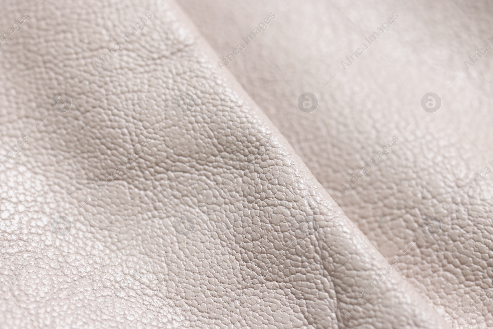 Photo of Beautiful beige leather as background, closeup view