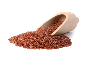 Photo of Scoop and uncooked brown rice on white background