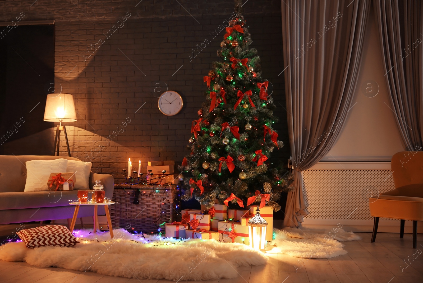 Photo of Stylish room interior with decorated Christmas tree