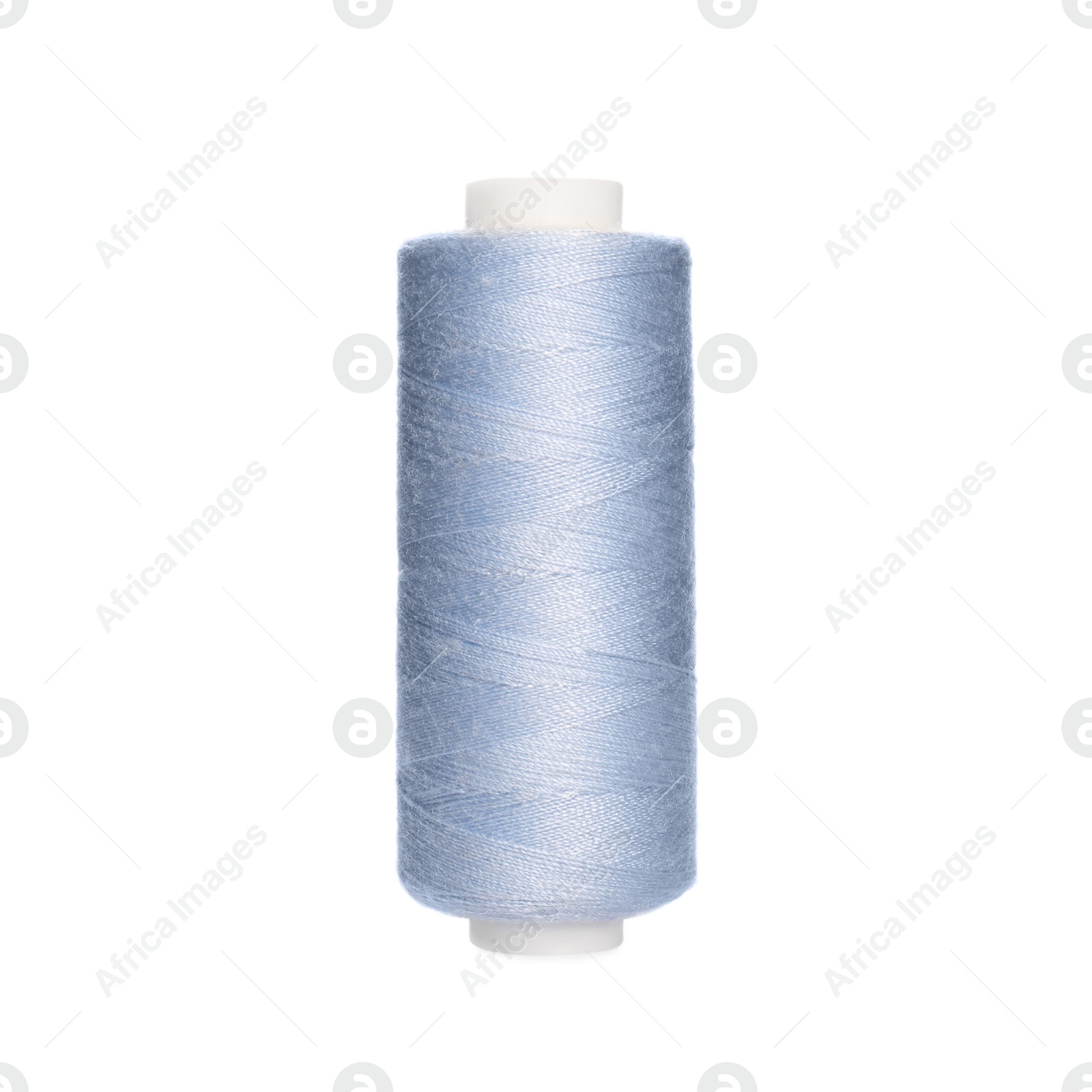 Photo of Spool of light blue sewing thread isolated on white