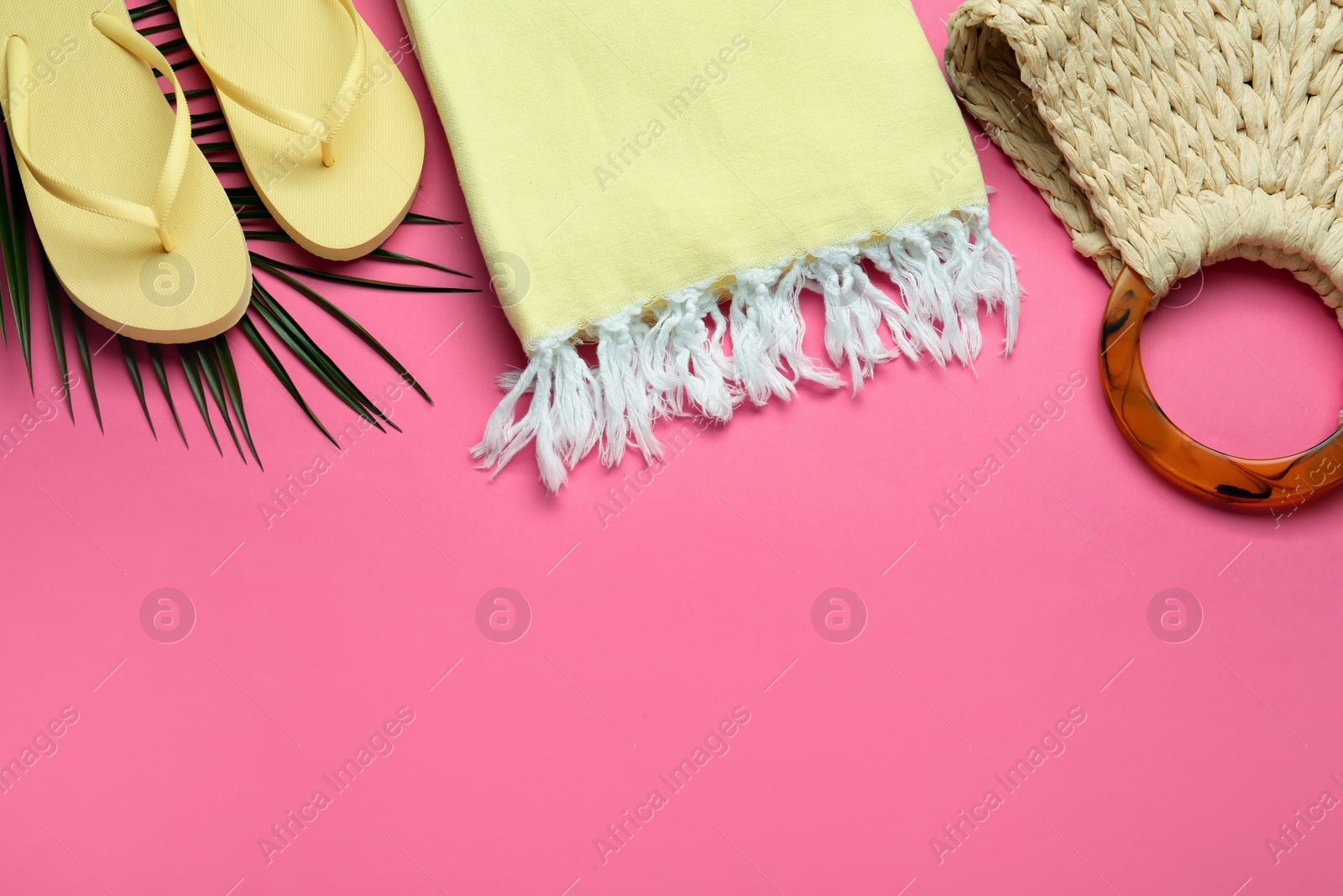 Photo of Flat lay composition with different beach objects on pink background, space for text