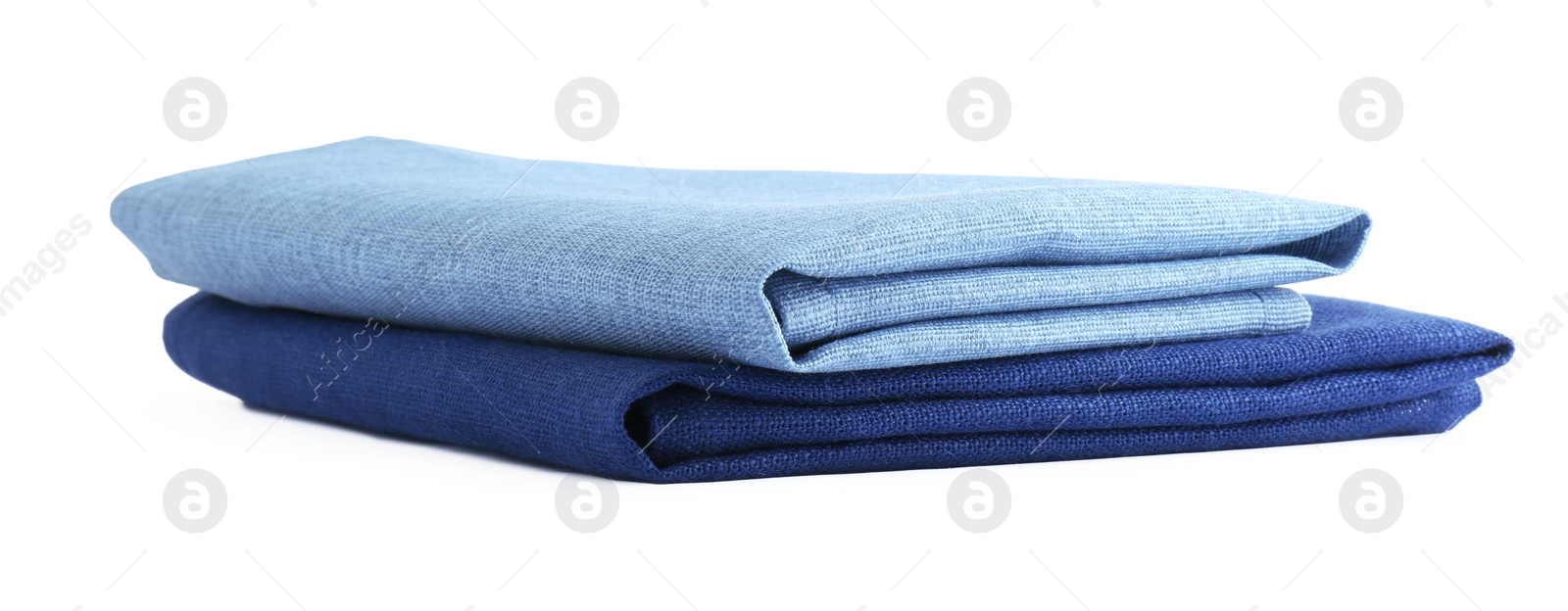 Photo of Stack of fabric napkins for table setting isolated on white