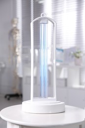 Photo of UV lamp for light sterilization on white table in hospital