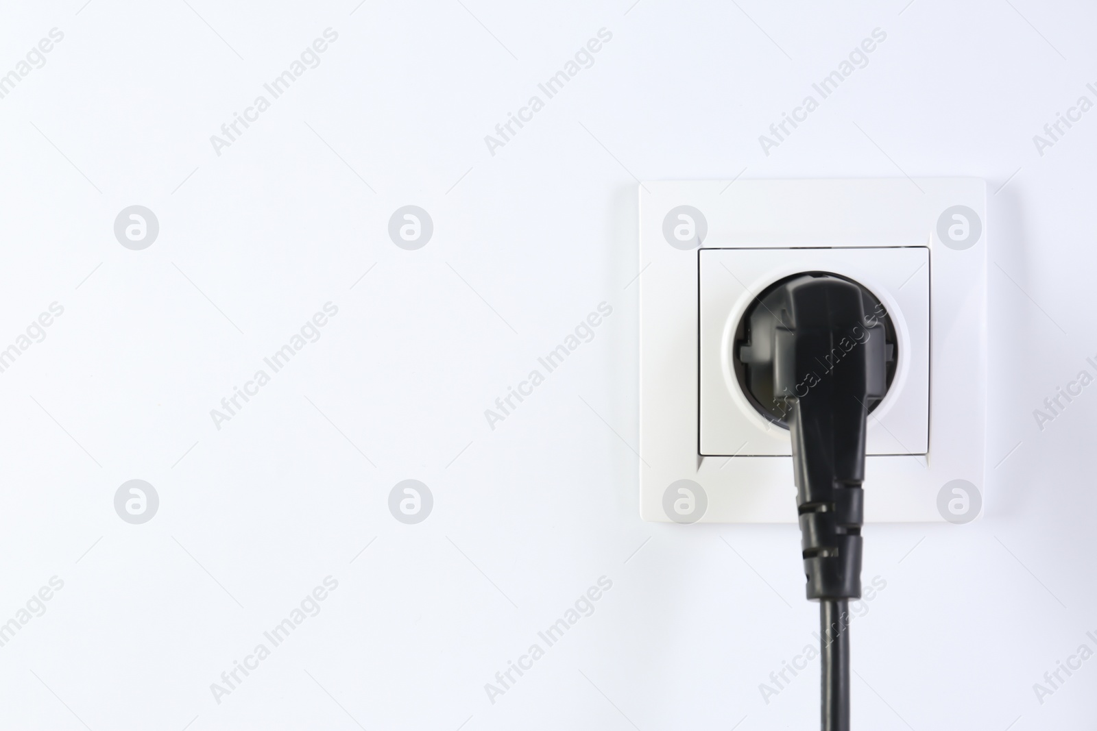 Photo of Power socket and plug on white background. Electrician's equipment