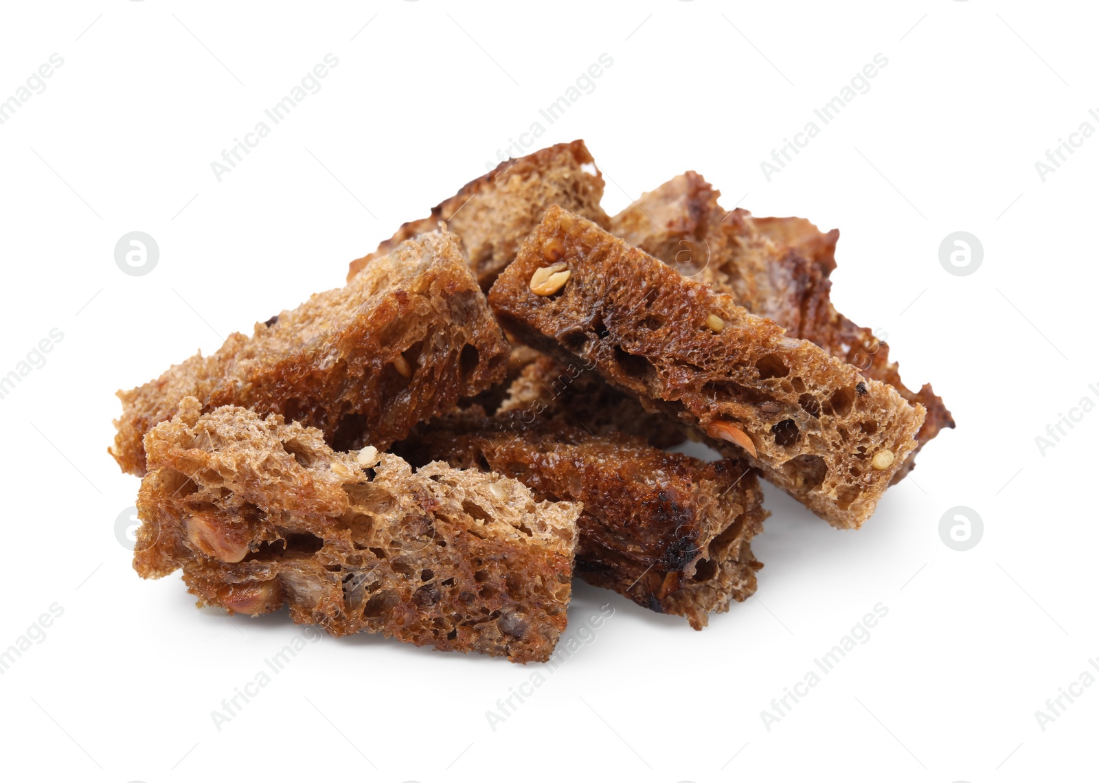 Photo of Heap of crispy rusks isolated on white