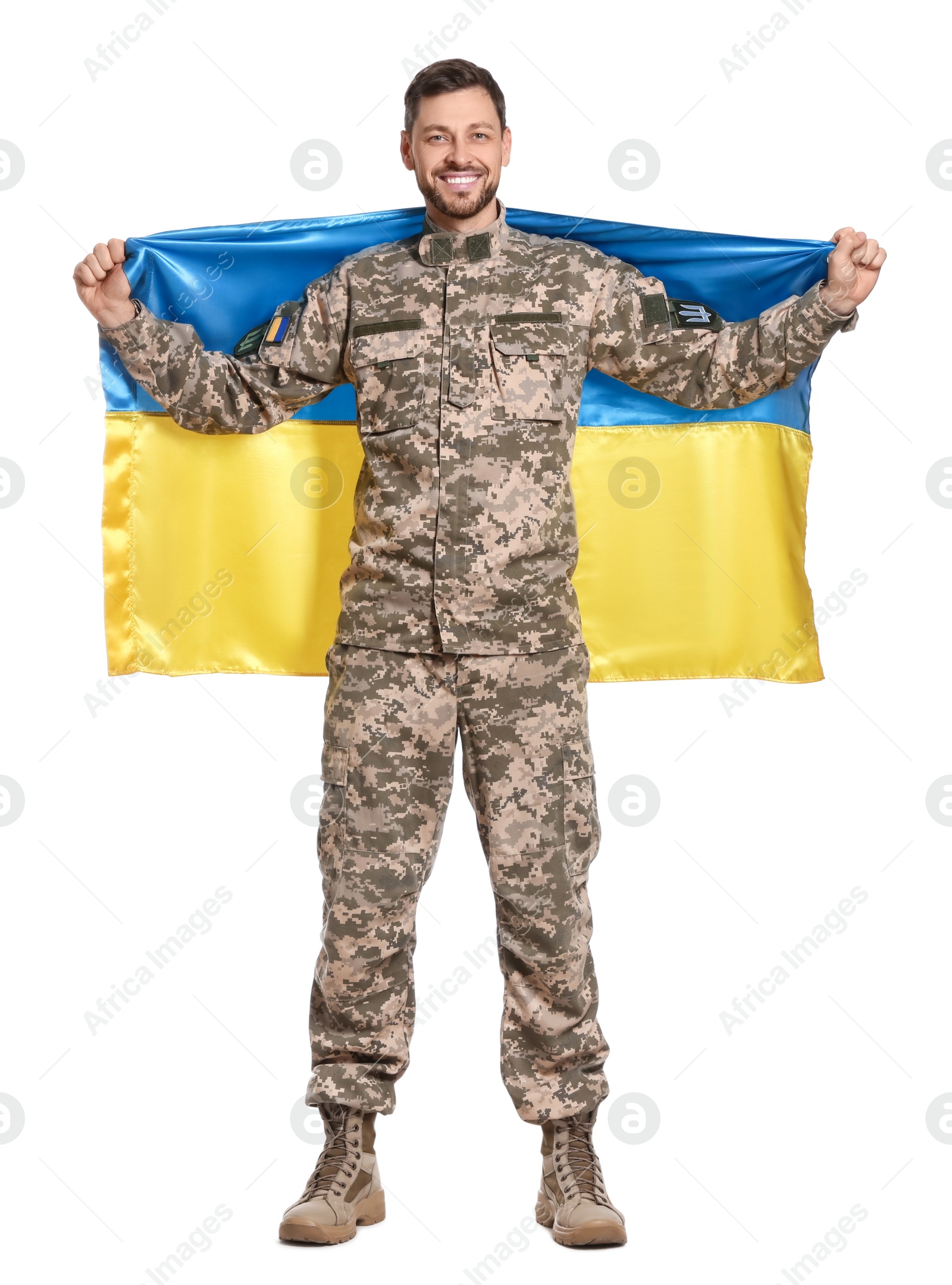 Photo of Soldier in military uniform with Ukrainian flag on white background