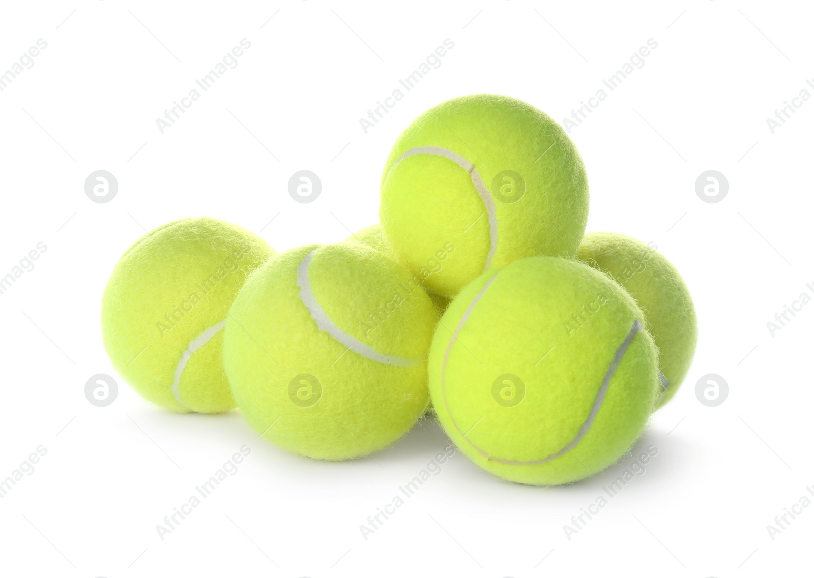 Photo of Heap of tennis balls on white background. Sports equipment