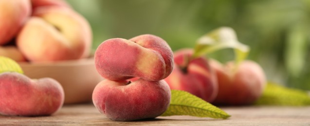 Image of Fresh flat peaches on table. Banner design with space for text