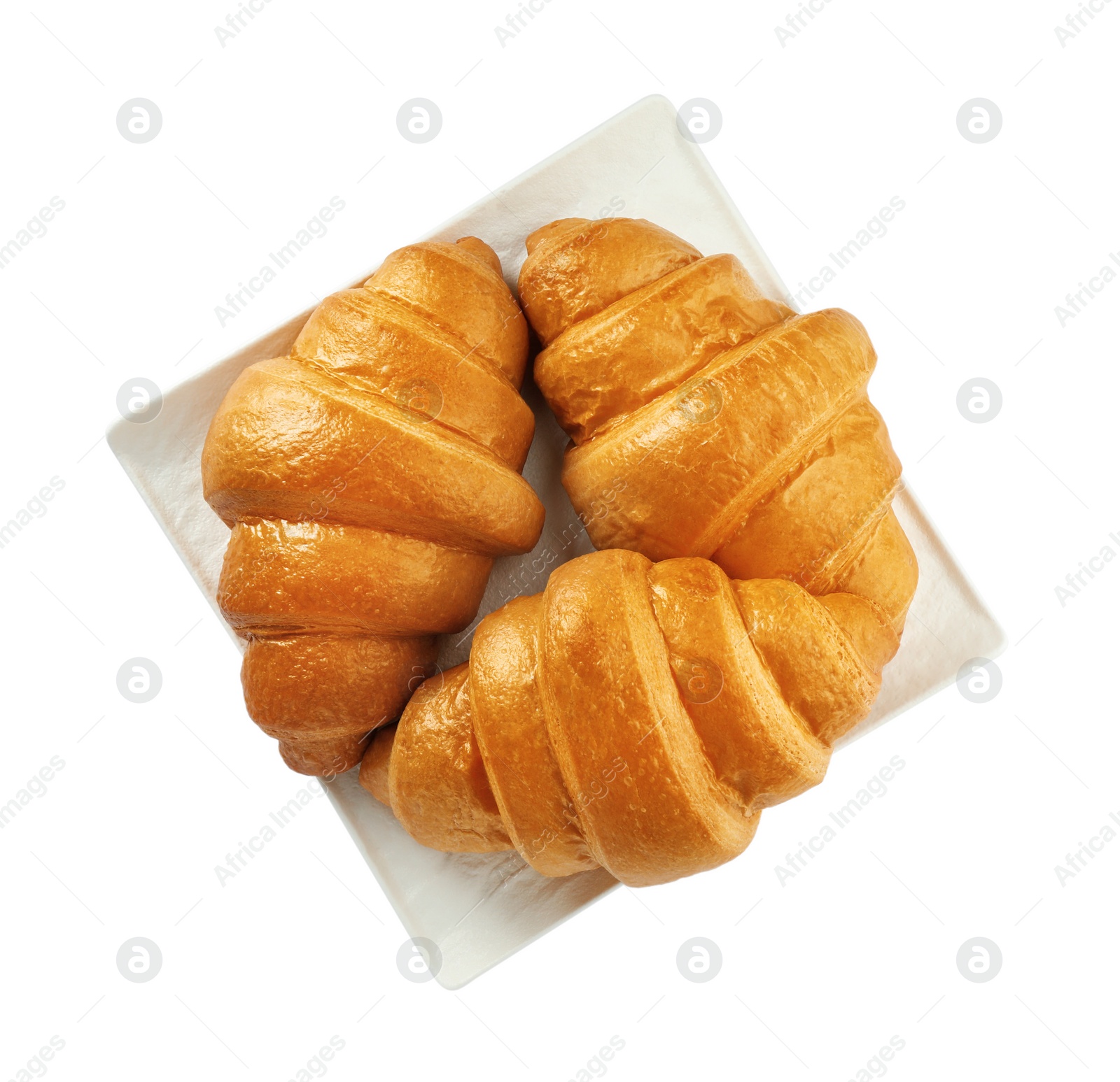Photo of Plate with delicious fresh croissants isolated on white, top view