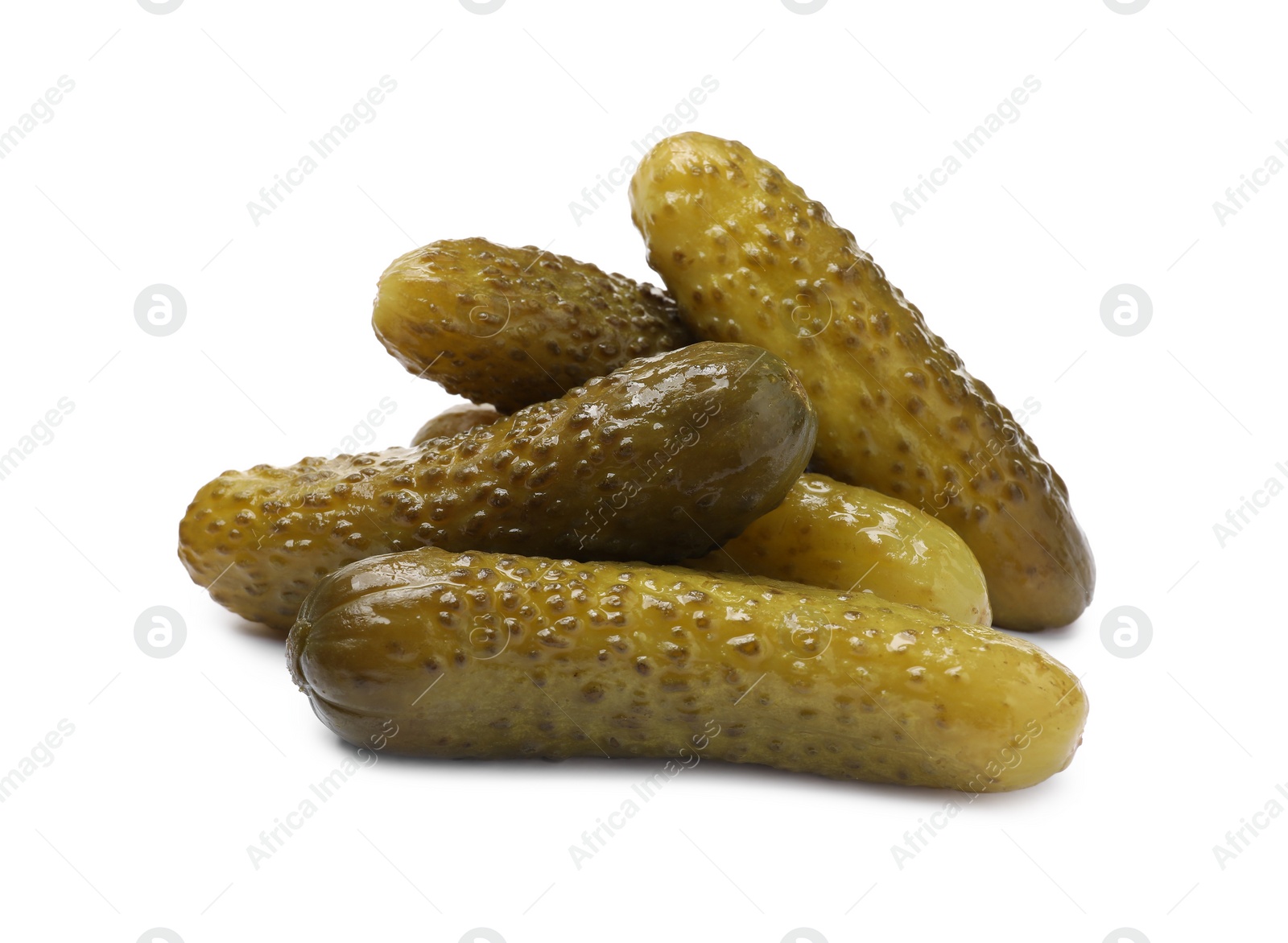 Photo of Pile of tasty pickled cucumbers isolated on white