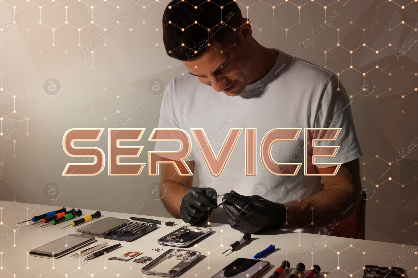 Image of Technician repairing broken smartphone at table indoors