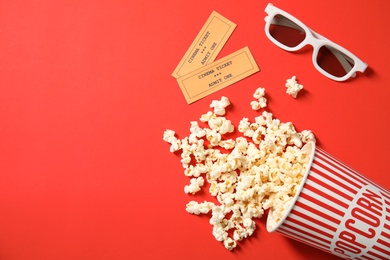 Flat lay composition with popcorn and space for text on color background. Cinema snack