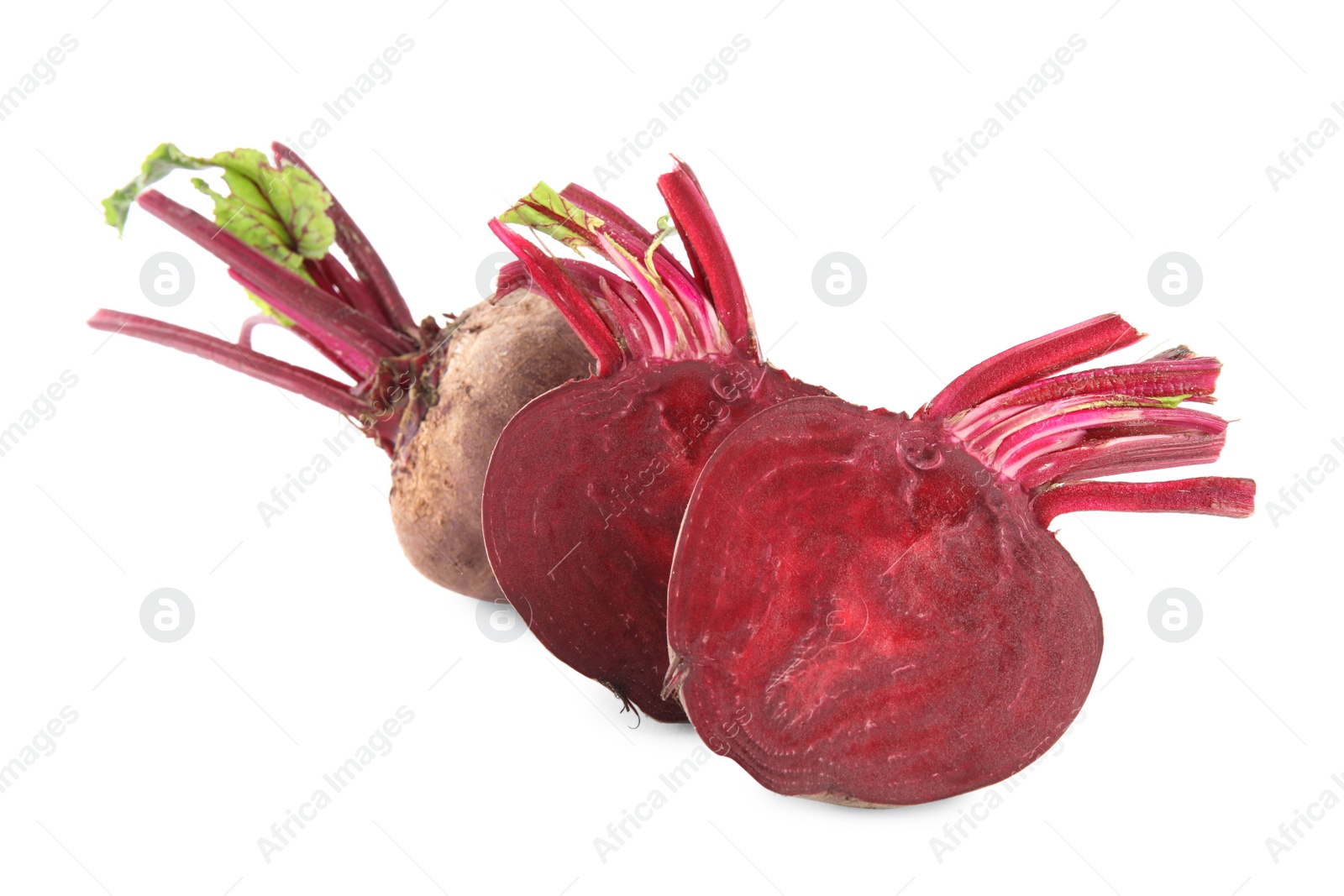 Photo of Whole and cut ripe beetroots on white background