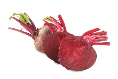 Photo of Whole and cut ripe beetroots on white background