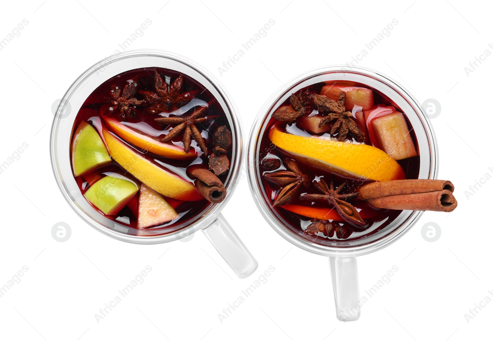 Photo of Cups with red mulled wine on white background, top view