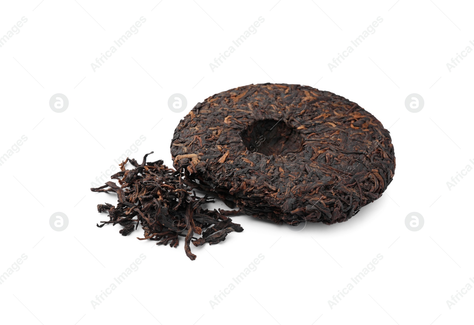 Photo of Broken disc shaped traditional Chinese pu-erh tea isolated on white