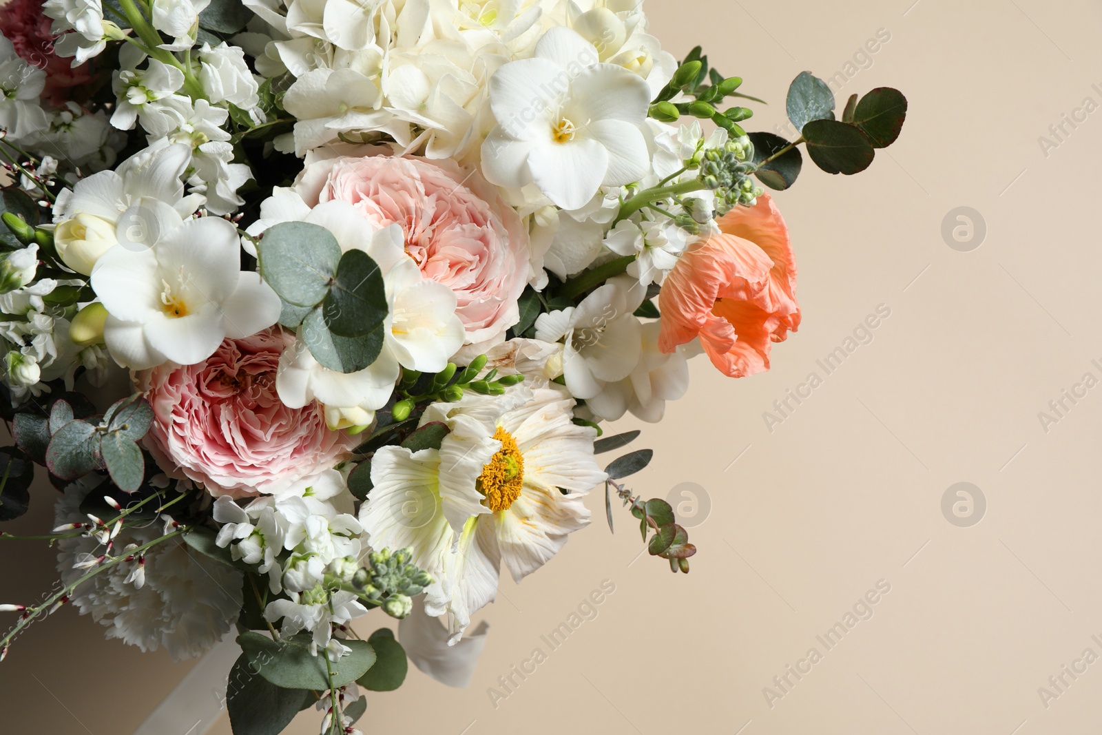 Photo of Bouquet of beautiful flowers on beige background, top view