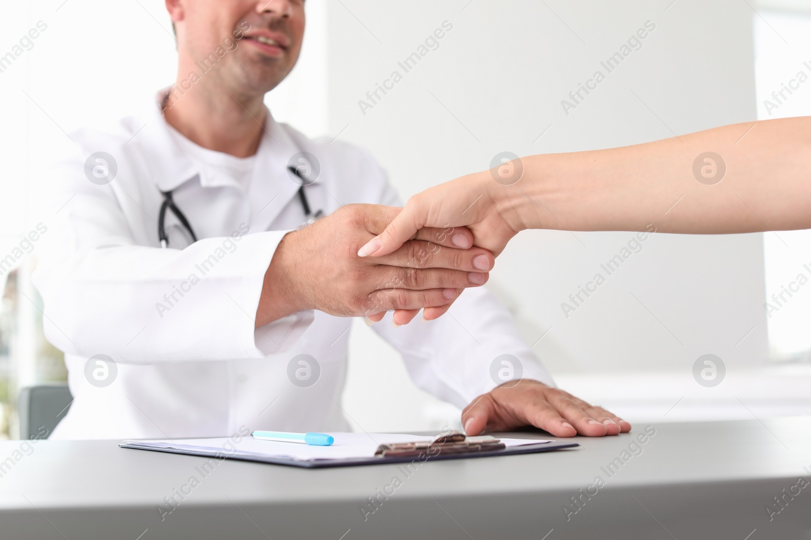 Photo of Patient having appointment with doctor in hospital