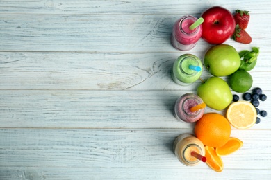 Photo of Flat lay composition with healthy detox smoothies and ingredients on wooden background