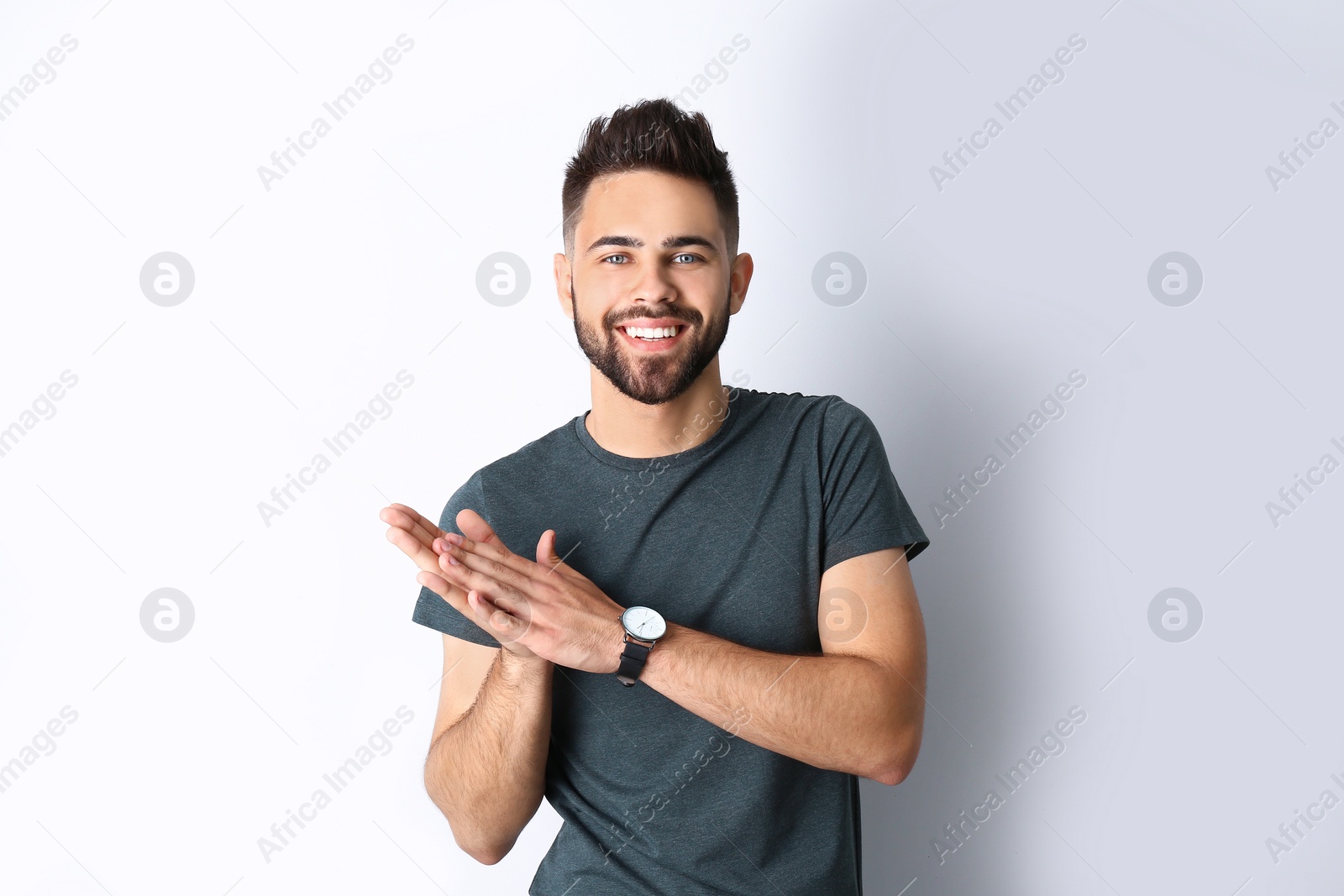 Photo of Portrait of handsome smiling man isolated on white