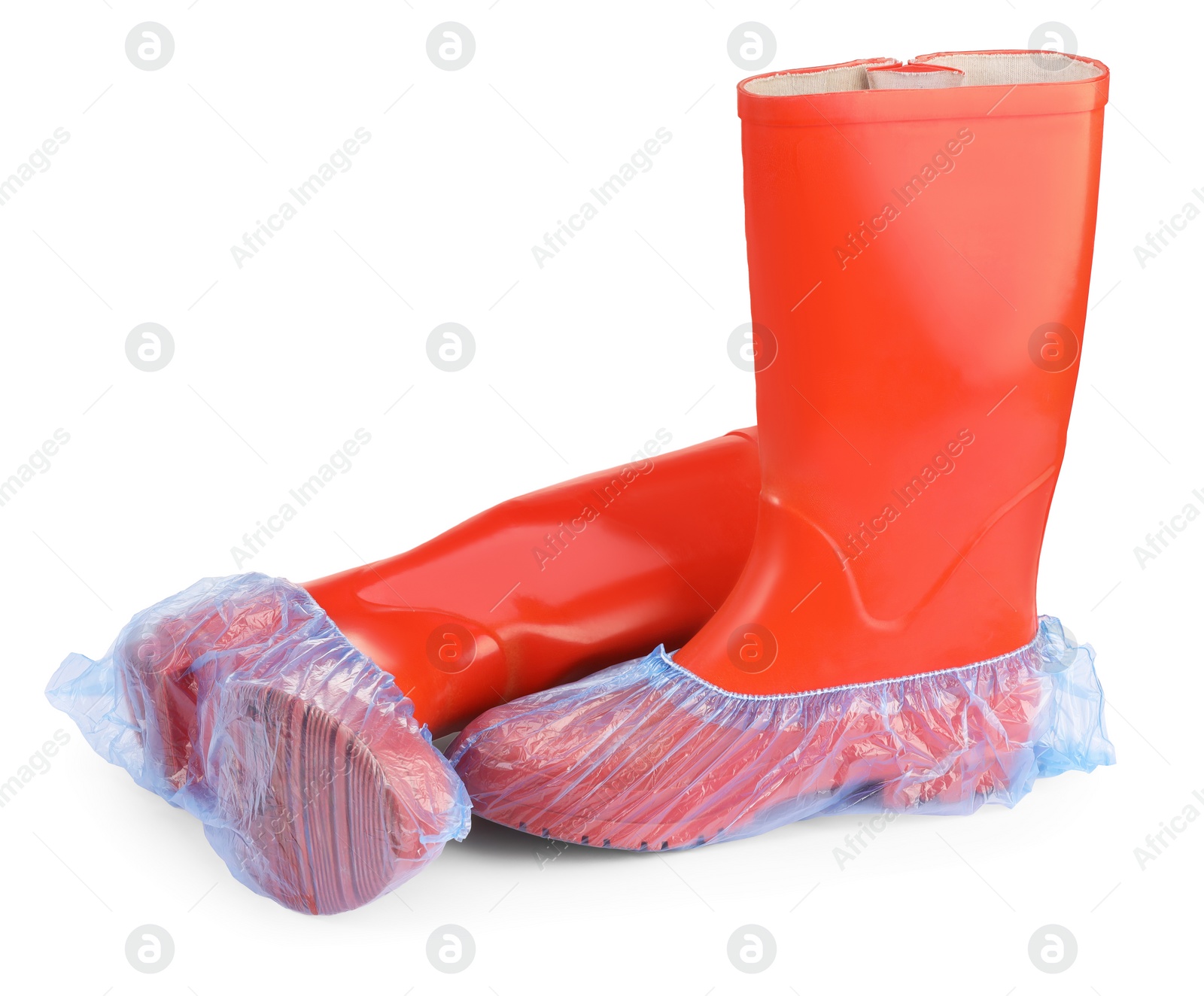 Photo of Rubber boots in blue shoe covers isolated on white