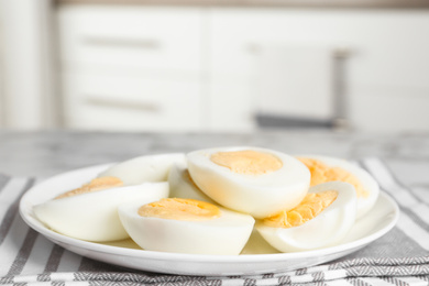 Photo of Tasty hard boiled eggs on ceramic plate