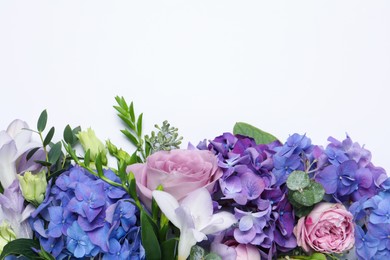 Beautiful composition with hortensia flowers on white background, flat lay. Space for text